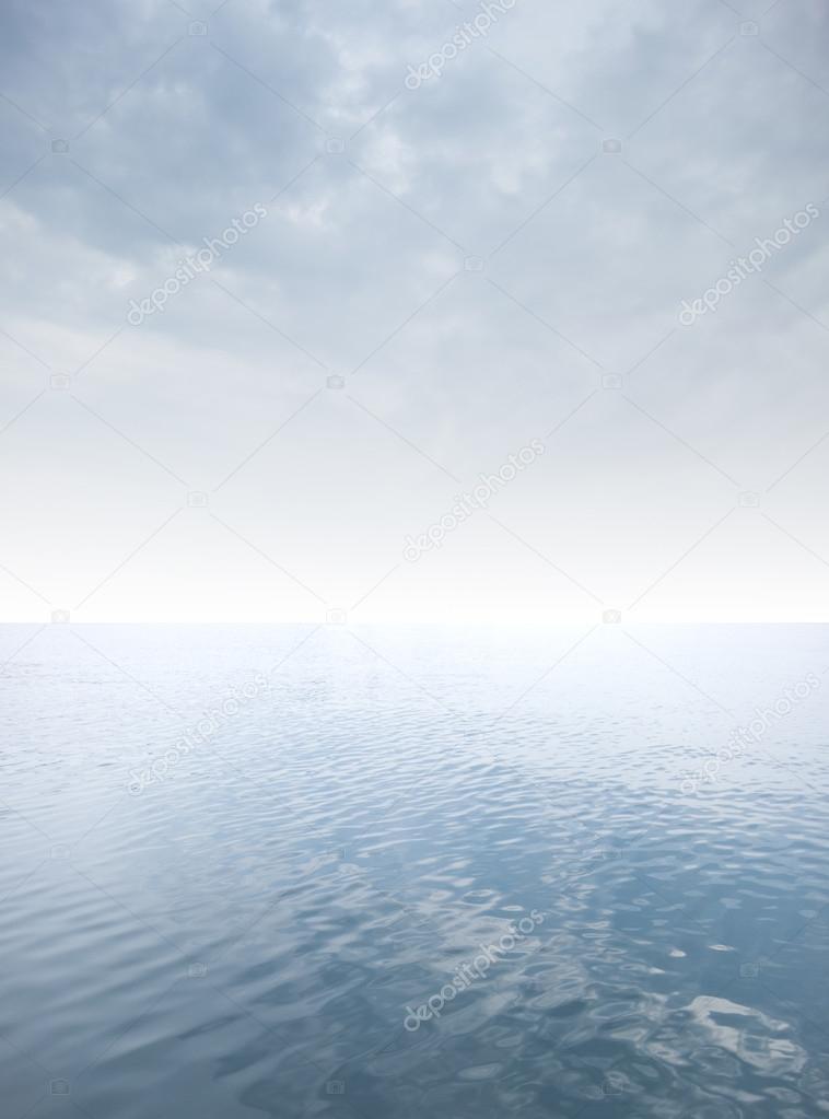 calm sea with cloudy sky at the horizon
