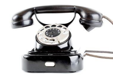 Beyaz arkaplanda eski model telefon