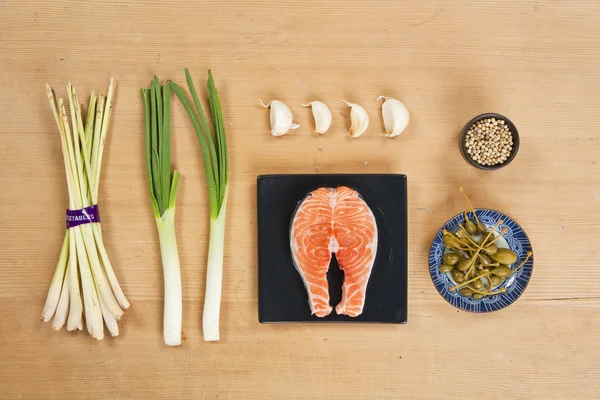 Salmon preparation ingredients on wooden background — Stock Photo, Image