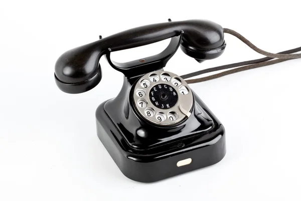 하얀 배경에 있는 오래 된 빈티지 전화기 — 스톡 사진