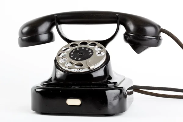 Старый винтажный телефон на белом фоне — стоковое фото