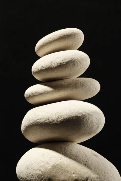 White stones on black background — Stock Photo, Image