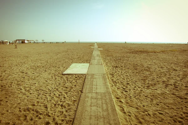 Vintage empty beach with a path — Stock Photo, Image