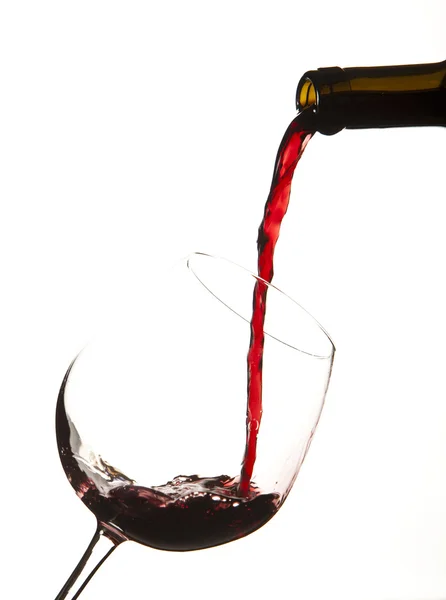 Red wine splash on a glass, white background. — Stock Photo, Image