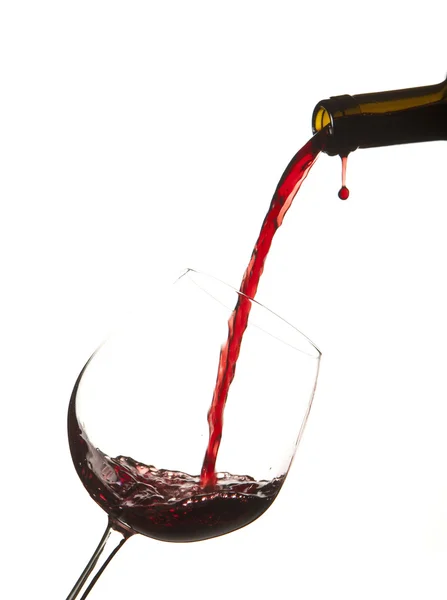 Red wine splash on a glass, white background. — Stock Photo, Image