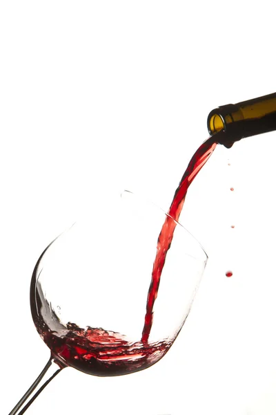 Red wine splash on a glass, white background. — Stock Photo, Image