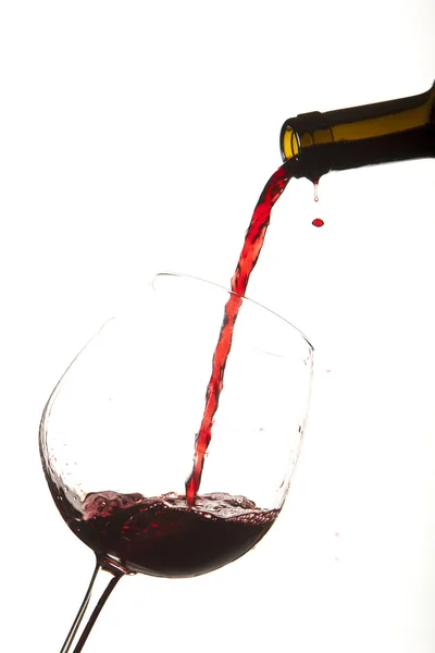 Red wine splash on a glass, white background. — Stock Photo, Image