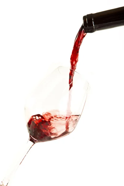 Red wine splash on a glass, white background. — Stock Photo, Image