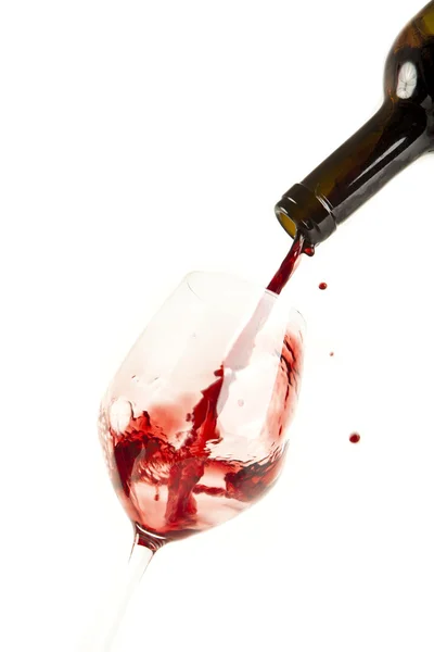 Red wine splash on a glass, white background. — Stock Photo, Image