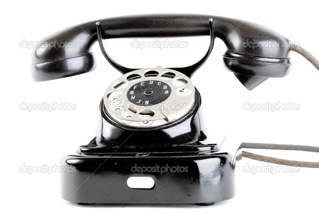 Old vintage telephone on white background