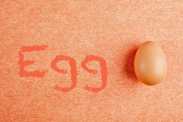 Easter egg on orange background — Stock Photo, Image