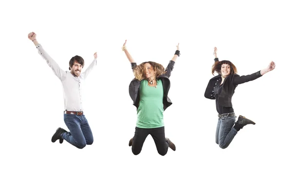 Três jovens felizes pulando — Fotografia de Stock