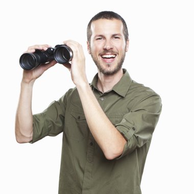 young man looking with binoculars, cheerful face expression