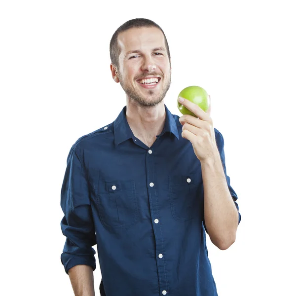 Cheerful beautiful man eating apple, isolated over white background — Stock Photo, Image