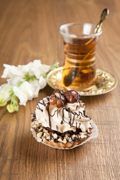 Different sort of beautiful pastry, small colorful sweet cakes with tea — Stock Photo, Image