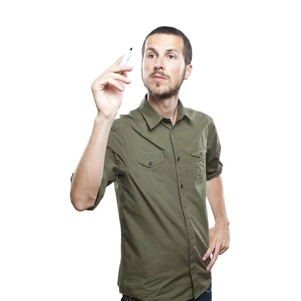 Young casual man writing something on glass board with marker — Stock Photo, Image