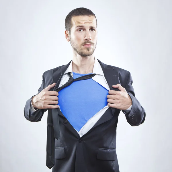 Young businessman acting like a super hero and tearing his shirt off — Stock Photo, Image