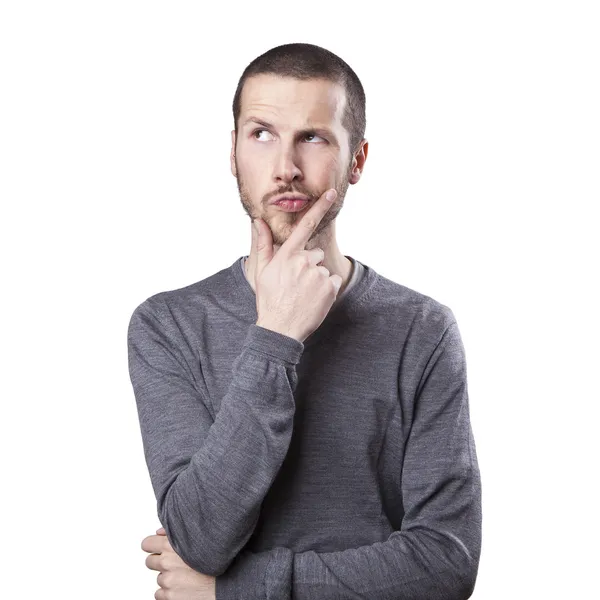 Portrait of handsome young thoughtful man isolated over white ba Royalty Free Stock Images