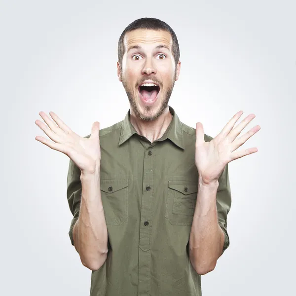 Portrait of a young beautiful man surprised face expression Stock Picture