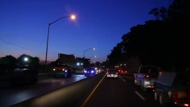 Evening construction traffic. — Stock Video