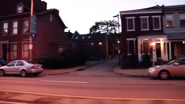 Driving at dusk in a Pittsburgh suburb. — ストック動画