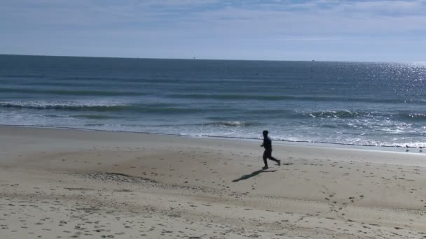 Jogging sur la plage — Video