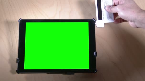 Swipe Credit Card on Green Screen Tablet PC — Stock Video