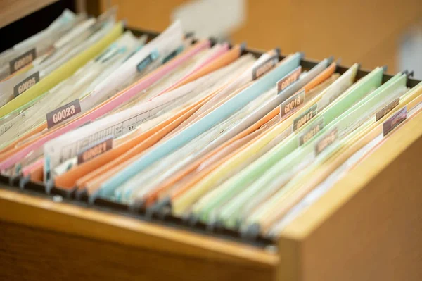 Close up view of documents in files placed in the filing cabinet