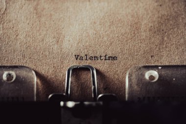 old typewriter with text Valentine on brown old paper
