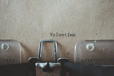 old typewriter with text Valentine on brown old paper