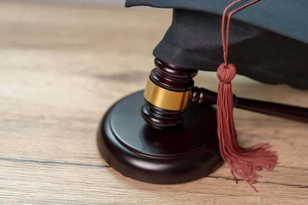 Black Graduation Hat and Gavel Concept of graduate online learning study international