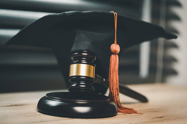 Black Graduation Hat and Gavel Concept of graduate online learning study international