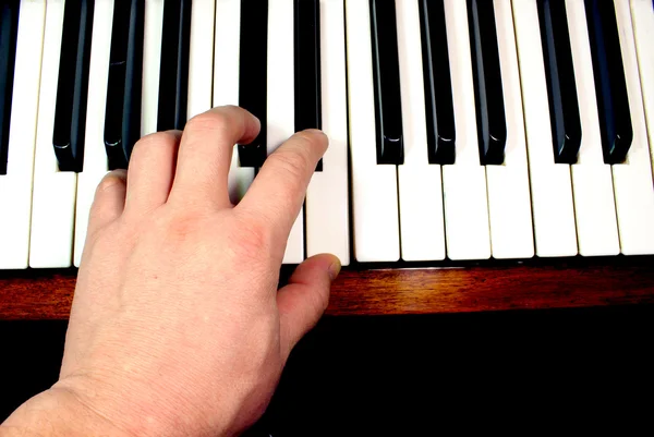 Hand on piano keys — Stock Photo, Image