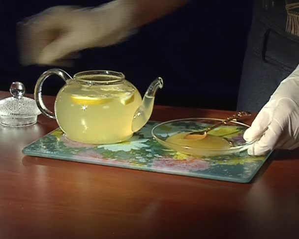 Teapot with ginger tea — Stock Video