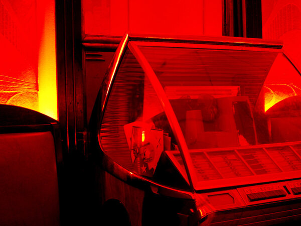 Juke box in a red lit room