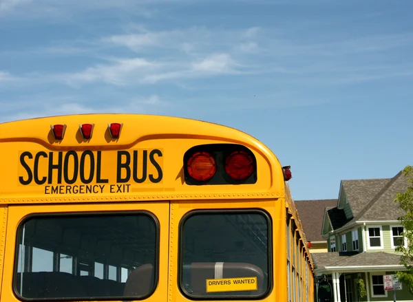 Yellow School bus against a blue sky