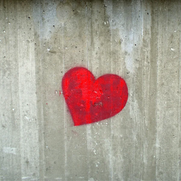 Red hearth on the concrete gray wall