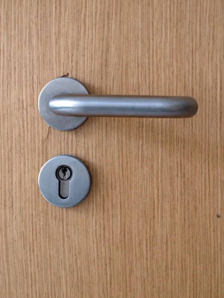 Metal lock on wooden door — Stock Photo, Image