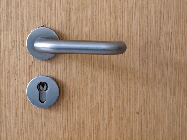 Wooden door with metal lock close up — Stock Photo, Image