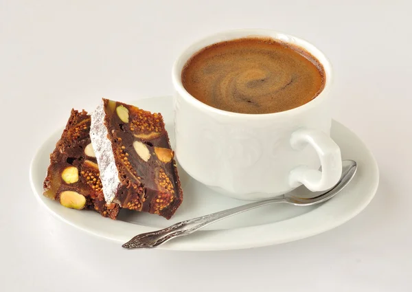 Uma xícara de café com Panforte — Fotografia de Stock