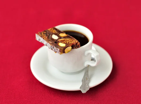 Uma xícara de café com Panforte — Fotografia de Stock