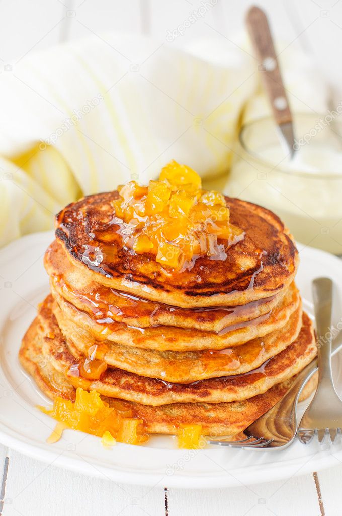 A Stack of Pumpkin Pancakes Topped with Pumpkin-in-Syrup Preserves, copy space for your text