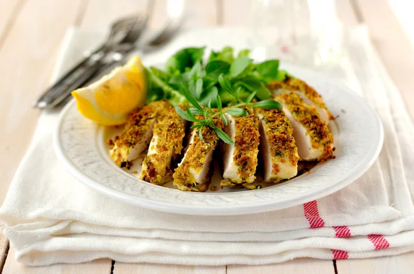 Sliced lemon herb crusted chicken breast — Stock Photo, Image
