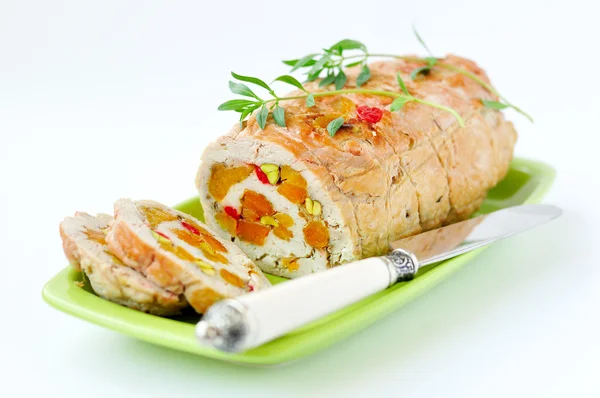 Baked turkey roll stuffed with dried apricots, cherries and pist — Stock Photo, Image