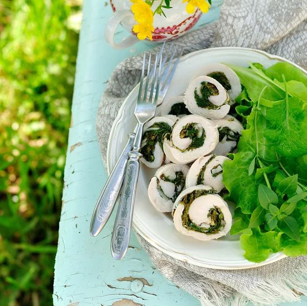 Chicken fillet rolls with fresh greens served with salad leaves — Stock Photo, Image