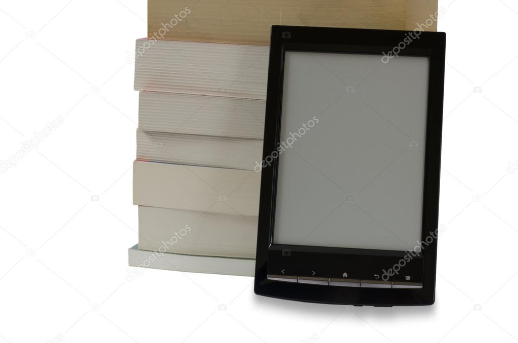 E-book reader in front of pile of books