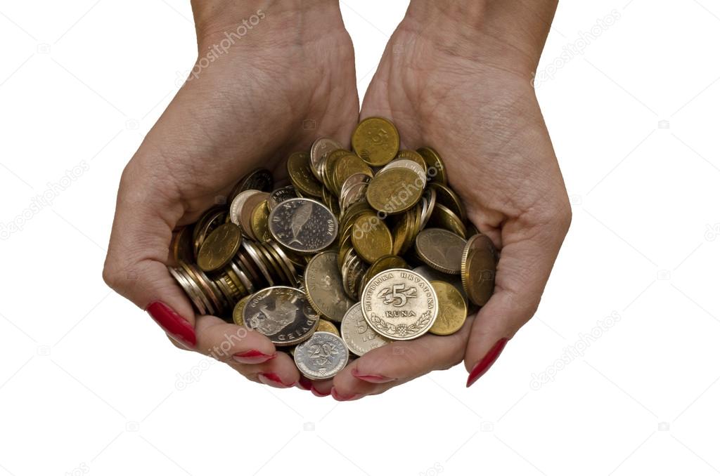 hands holding coins isolated in white