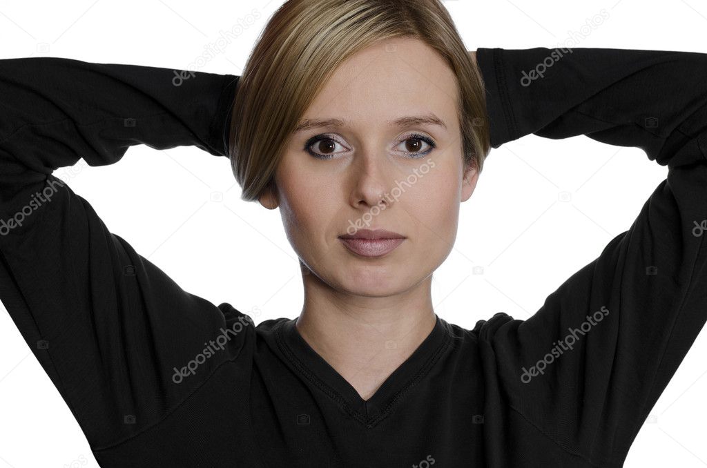 Portrait of a young woman holding her hair up on white background