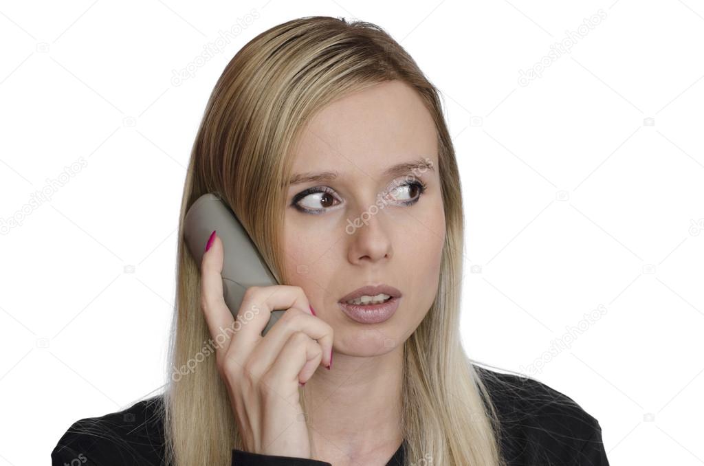 Young woman talking on the phone on white background