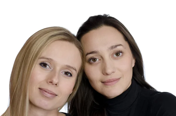 Duas meninas sorrindo em um fundo branco — Fotografia de Stock